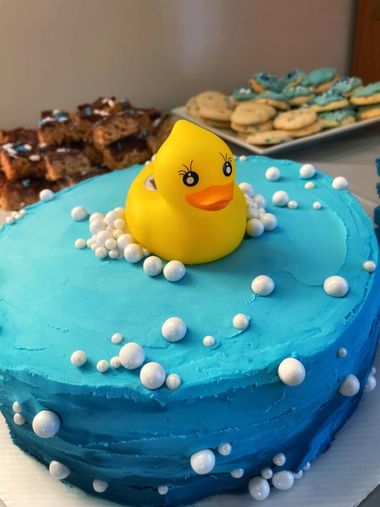 Rubber duckie on baby shower cake.